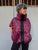 Burgundy quilted vest with a black zipper