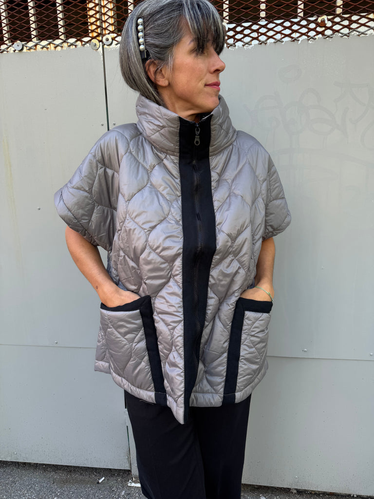 Grey quilted vest with a black zipper