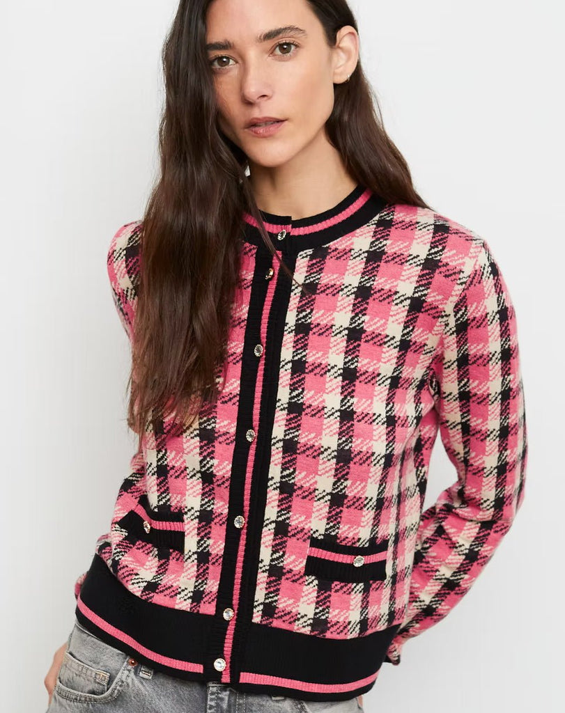 A pink and black plaid button up cardigan