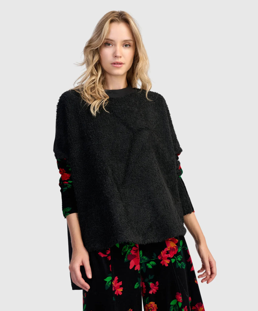 Black pullover with colorful floral pattern sleeves