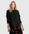 Black pullover with colorful floral pattern sleeves
