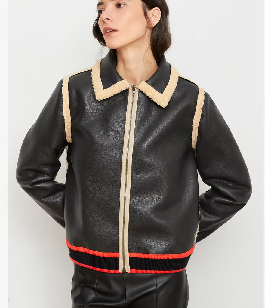 Black faux leather jacket with beige and red trim 