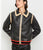 Black faux leather jacket with beige and red trim 