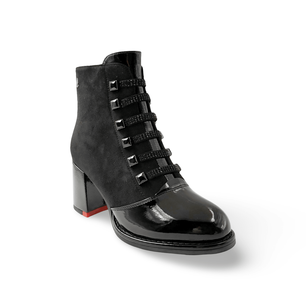 Black ankle boot with decorative details 