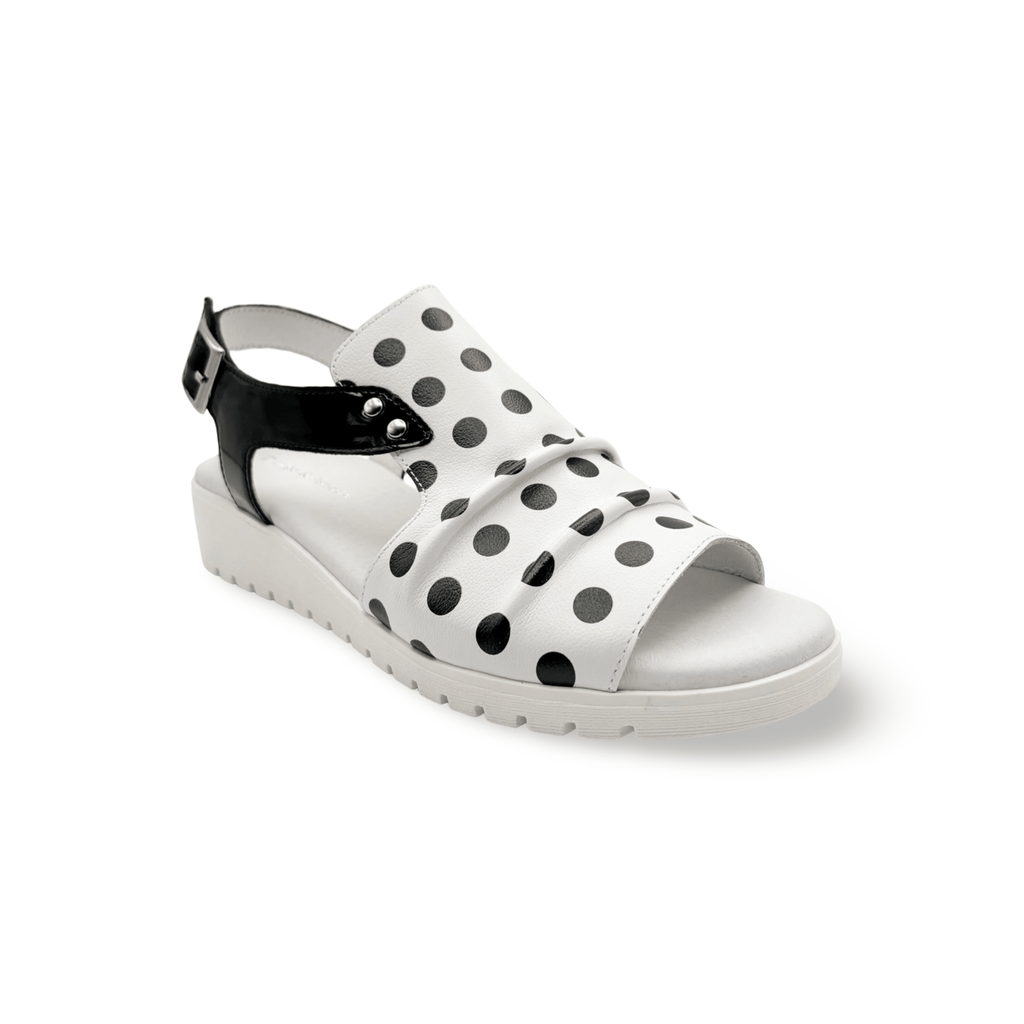 White sandal with black polka dots, adjustable velcro closure 